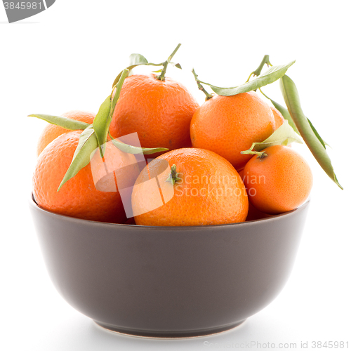 Image of Tangerines on ceramic brown  bowl 