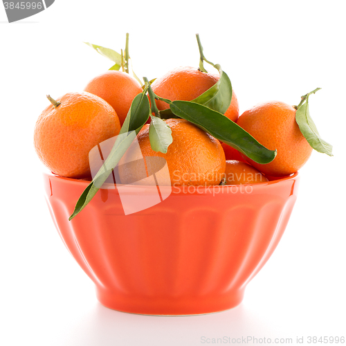 Image of Tangerines on ceramic orange bowl 