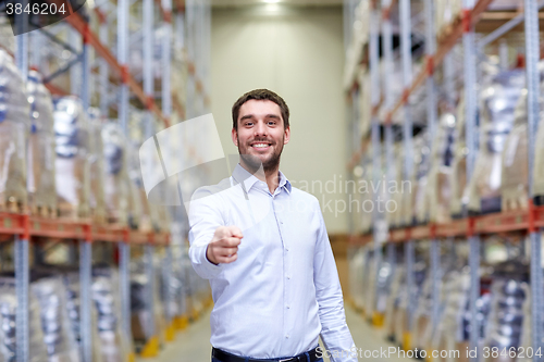 Image of happy man at warehouse