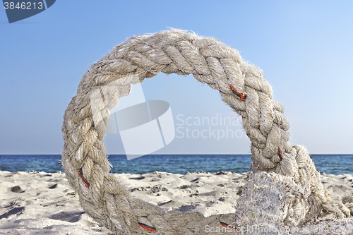 Image of Ring of old rope on a seashore