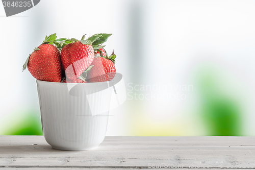 Image of Strawberries in a white cup