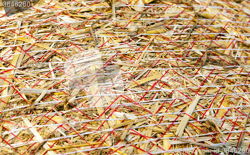 Image of haystacks in a field of straw  