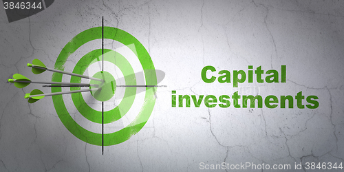 Image of Money concept: target and Capital Investments on wall background