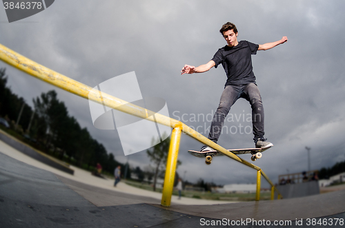 Image of Skateboarder doing a board slide