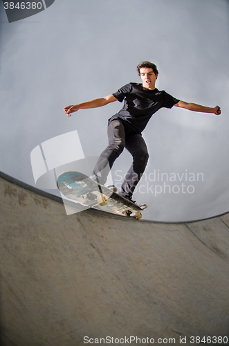 Image of Skateboarder doing a grind