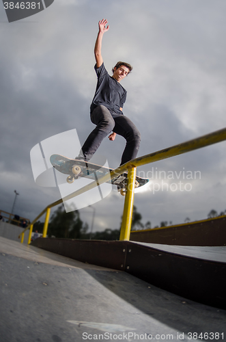 Image of Skateboarder doing a board slide