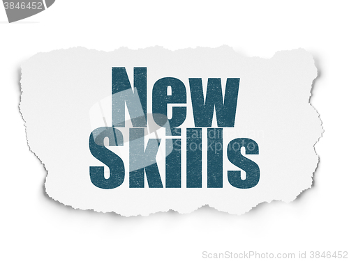 Image of Education concept: New Skills on Torn Paper background