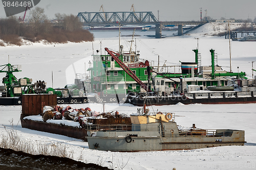 Image of pump-dredge and boats on winter parking