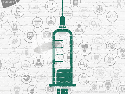 Image of Health concept: Syringe on wall background