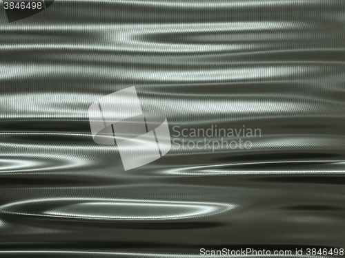 Image of folding metallic texture material with waves and ripples