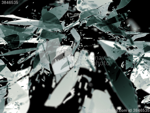 Image of Destructed glass pieces isolated on black shallow DOF