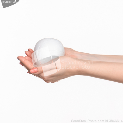 Image of Hands holding a egg on white background