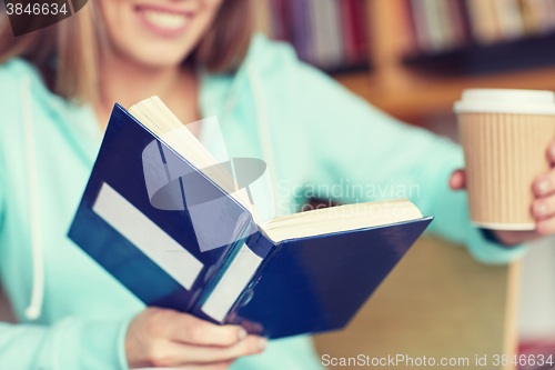 Image of close up of student reading book at school