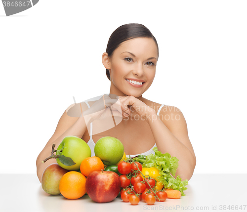 Image of happy woman with lot of fruits and vegetables