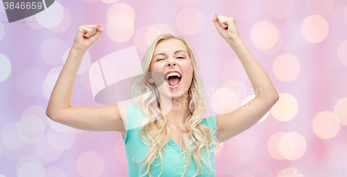 Image of happy young woman or teen girl celebrating victory