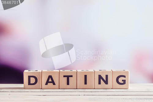 Image of Dating sign in wood on a table