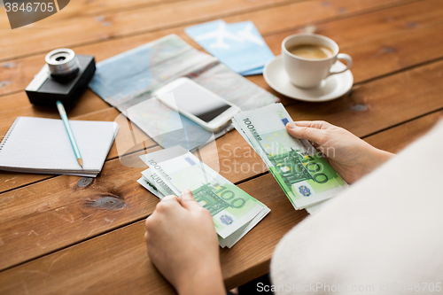 Image of close up of traveler hands counting euro money