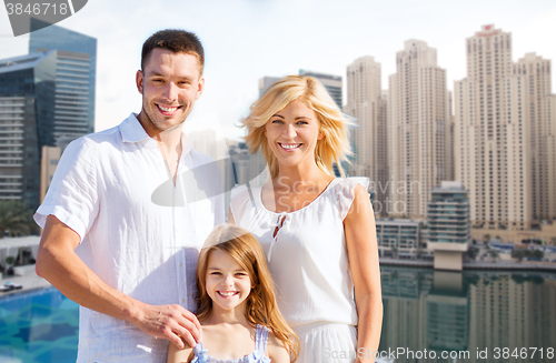 Image of happy family over dubai city background
