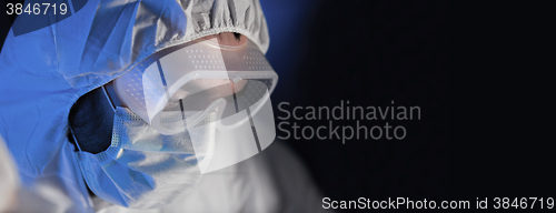 Image of close up of scientist face in chemical lab