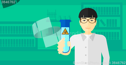 Image of Laboratory assistant with test tube.