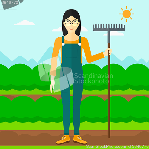 Image of Farmer with rake.