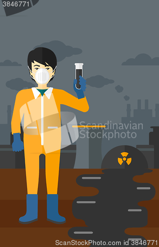 Image of Laboratory assistant with test tube.