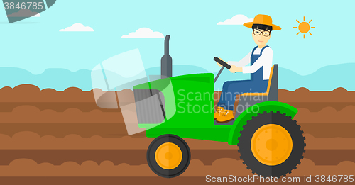 Image of Farmer driving tractor.