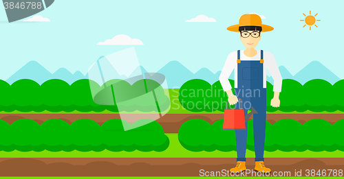 Image of Farmer with watering can.