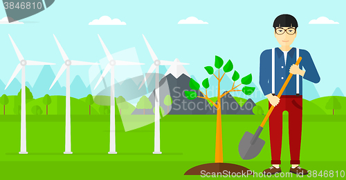 Image of Man plants tree.
