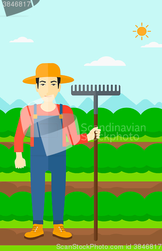 Image of Farmer with rake.