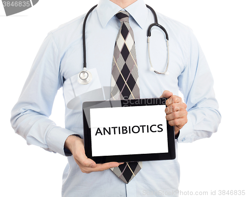 Image of Doctor holding tablet - Antibiotics