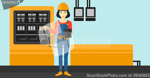 Image of Electrician with electrical equipment.