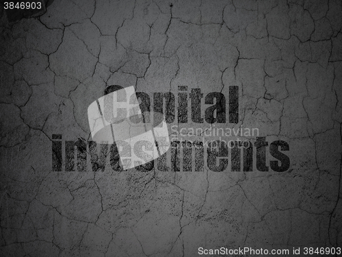 Image of Currency concept: Capital Investments on grunge wall background