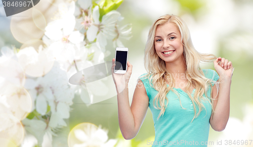 Image of happy young woman or teenage girl with smartphone