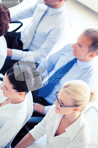 Image of businessmen and businesswomen on conference