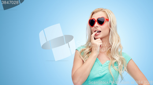 Image of happy young blonde woman or teenager in sunglasses