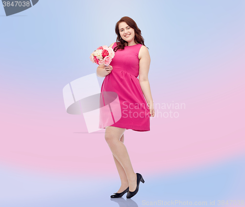 Image of happy young plus size woman with flower bunch