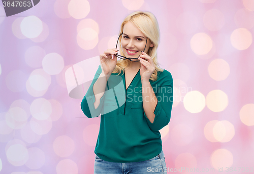 Image of smiling young woman with eyeglasses