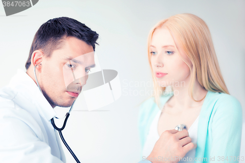 Image of male doctor with patient