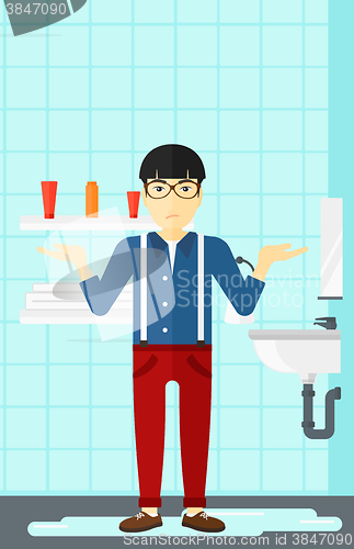 Image of Man in despair standing near leaking sink.