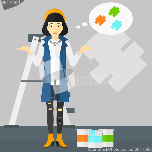Image of Woman choosing paint color.