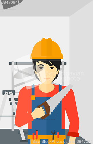 Image of Smiling worker with saw.