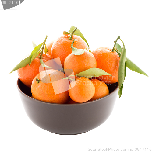 Image of Tangerines on ceramic brown  bowl 