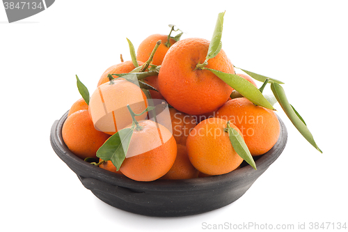 Image of Tangerines on clay bowl 