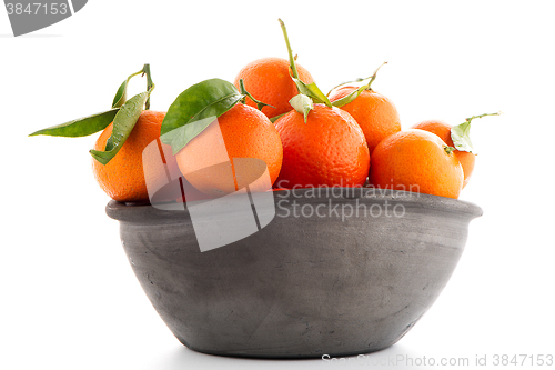 Image of Tangerines on clay bowl 