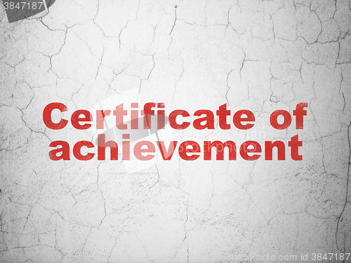 Image of Learning concept: Certificate of Achievement on wall background