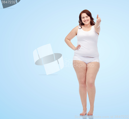 Image of plus size woman in underwear showing thumbs up