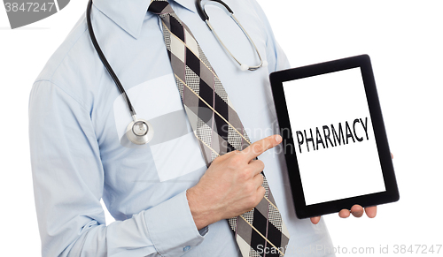 Image of Doctor holding tablet - Pharmacy