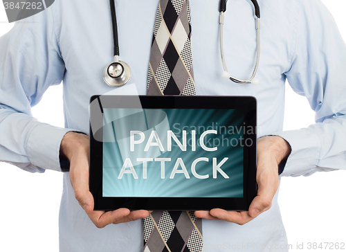 Image of Doctor holding tablet - Panic attack