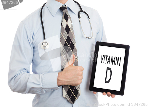 Image of Doctor holding tablet - Vitamin D